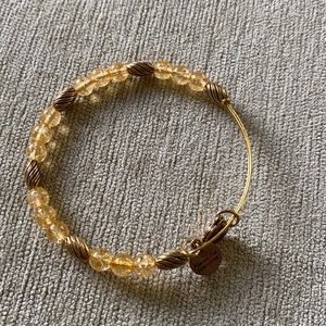 Alex and Ani bangle with clear gold beads and gold beads